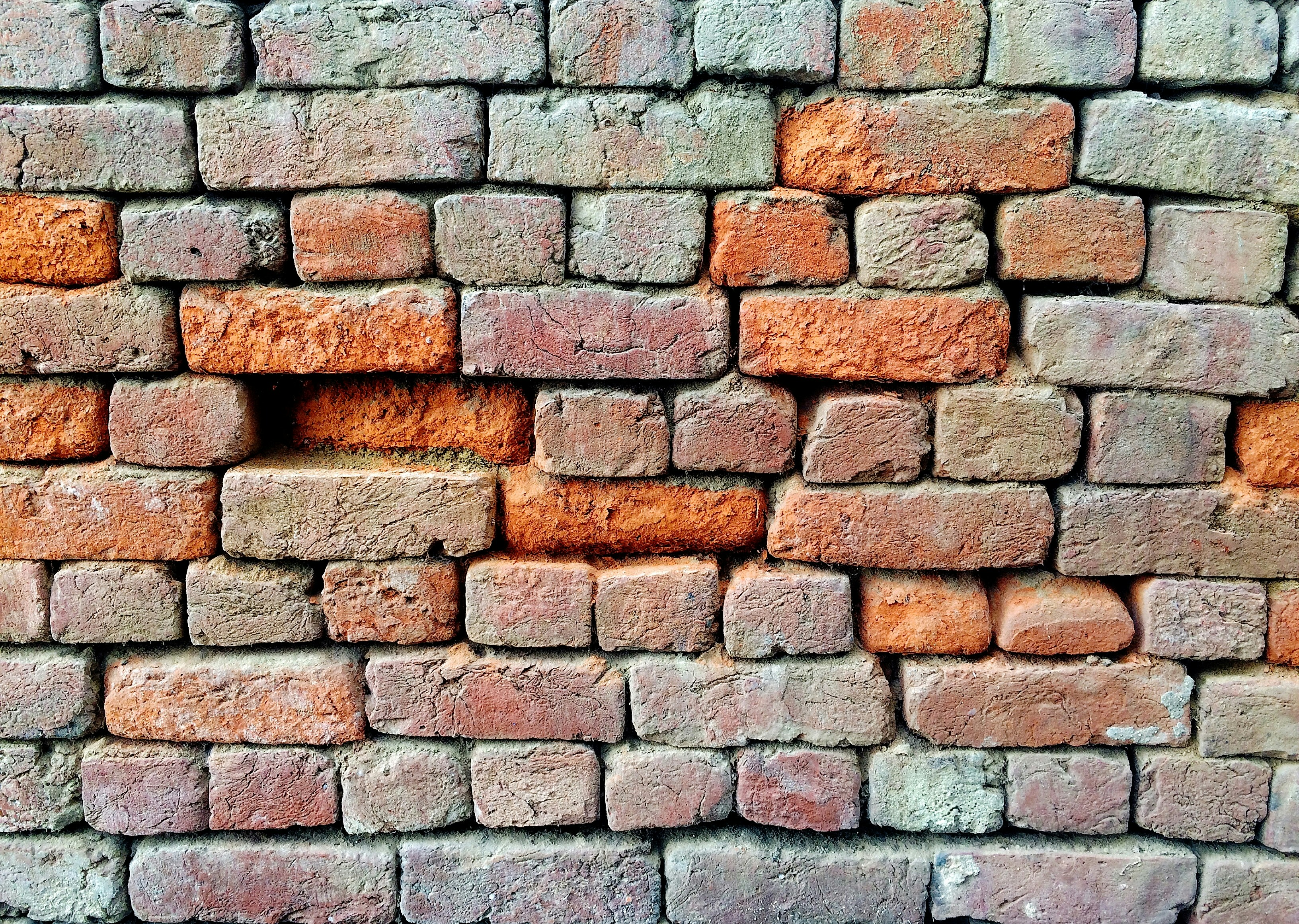Mur de briques rouges, illustration de la brique manquante d’un dispositif